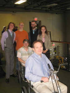 Kevin, His Wheels Design Engineer is driving. Alice, His Wheels Executive Director is riding in the cargo trailer. Standing from left to right is David, Sam, Alex, Loren.
